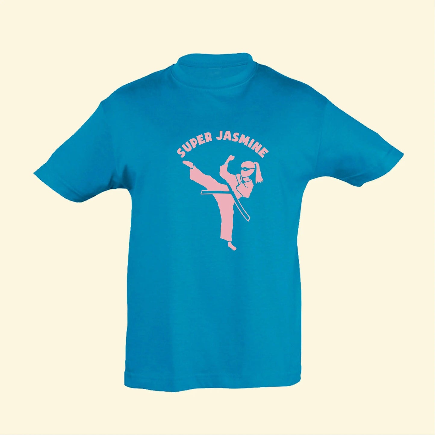 Aqua t shirt with a super kicking illustration and the text Super Jasmine, printed on the front in light pink