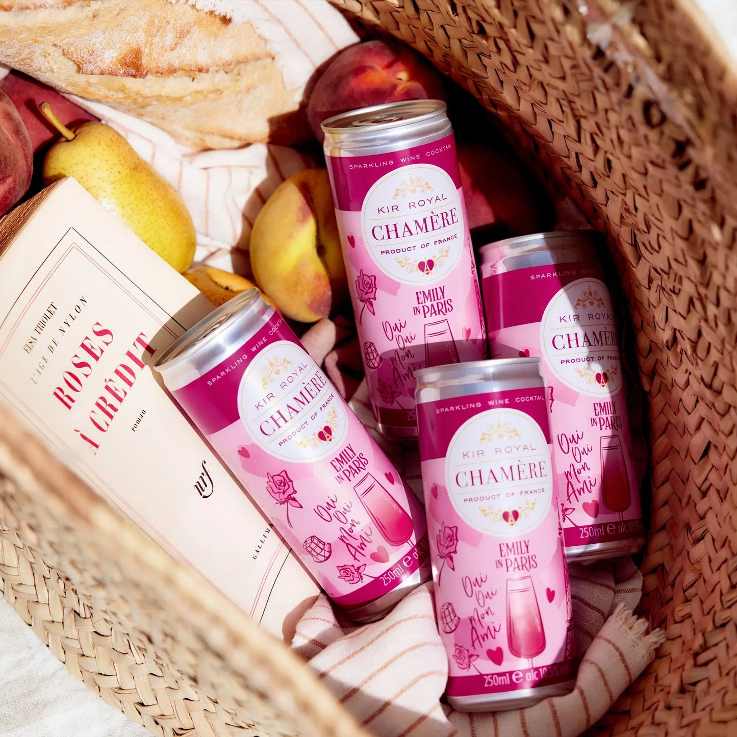 Wicker basket with four cans of Chamère inside.