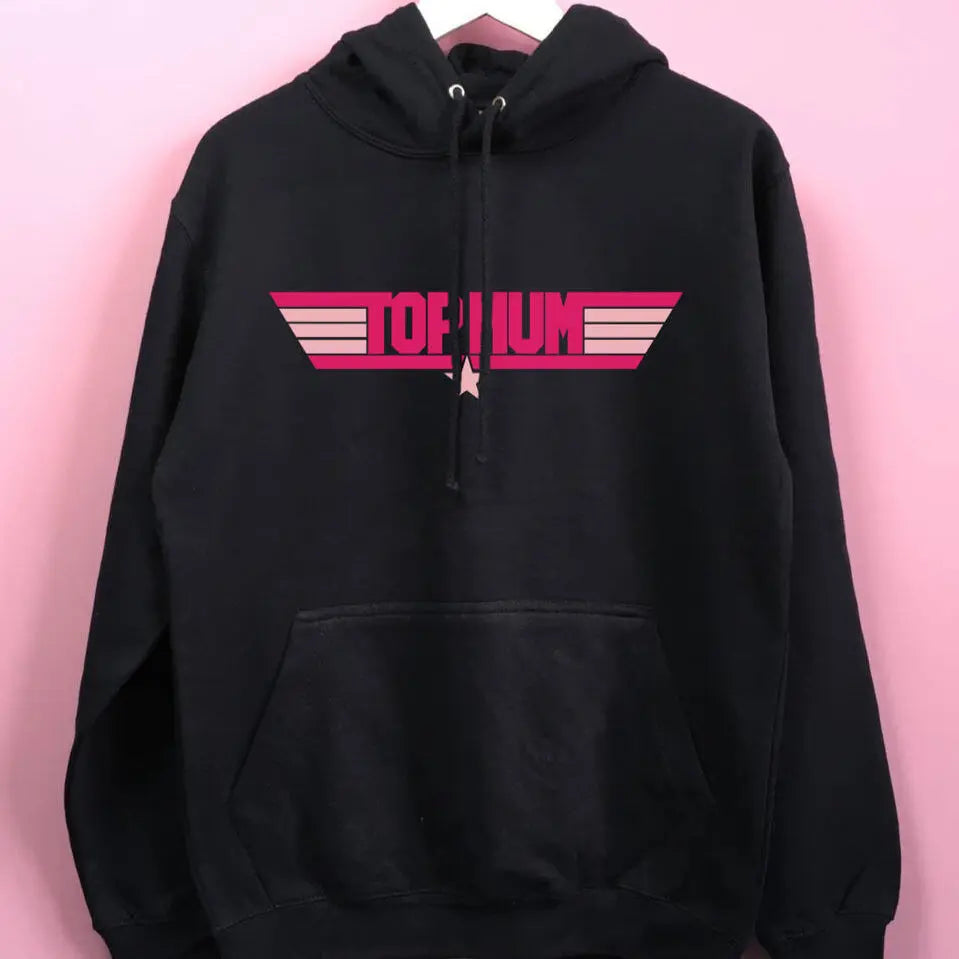 Navy hoodie with Top Mum printed on the front in fuchsia pink, with light pink stripes either side and a star underneath. The hoodie is set against a pink background.