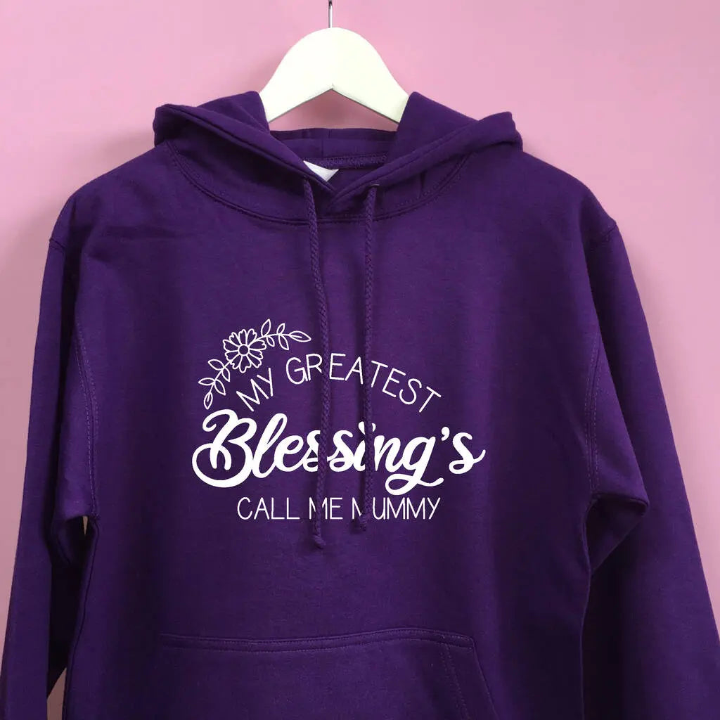 Purple hoodie with a floral design and the text My Greatest Blessing's Call Me Mummy printed on the front in white. A lovely mother's day gift