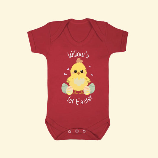 Red babygrow with a chick and Easter eggs with the text Willow's 1st Easter on the front