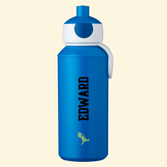 Blue pop up bottle with the name Edward printed in academy font and black print colour and a full coloured dinosaur printed at the bottom of the bottle.