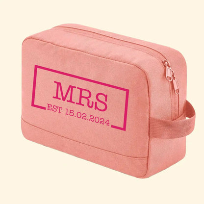 Pink wash back with Mrs in the middle of a rectangle with a gap at the bottom. The date EST 15.02.2024 is in the gap, printed in lockers American type in fuchsia pink