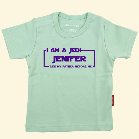 Light Green t shirt with a Star Wars style film surround, with the text I am a Jedi like my father before me and the name Jenifer  in the center, printed in purple