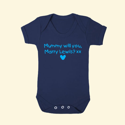 Navy short sleeved envelope nexy babygrow with two lines of personalisation - Mummy will you, Marry Lewis? xx - with a heart underneath. Printed in kids and blue print. 