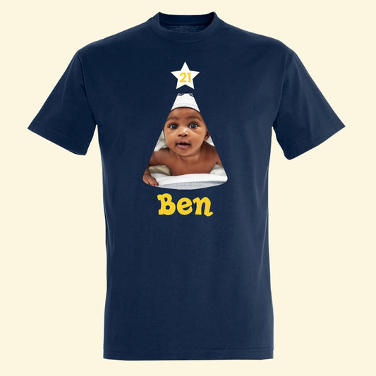 Navy T shirt with a party hat that has a photo of the Birthday celebrant. A star on the top of the hat with the age in and their name under the hat.