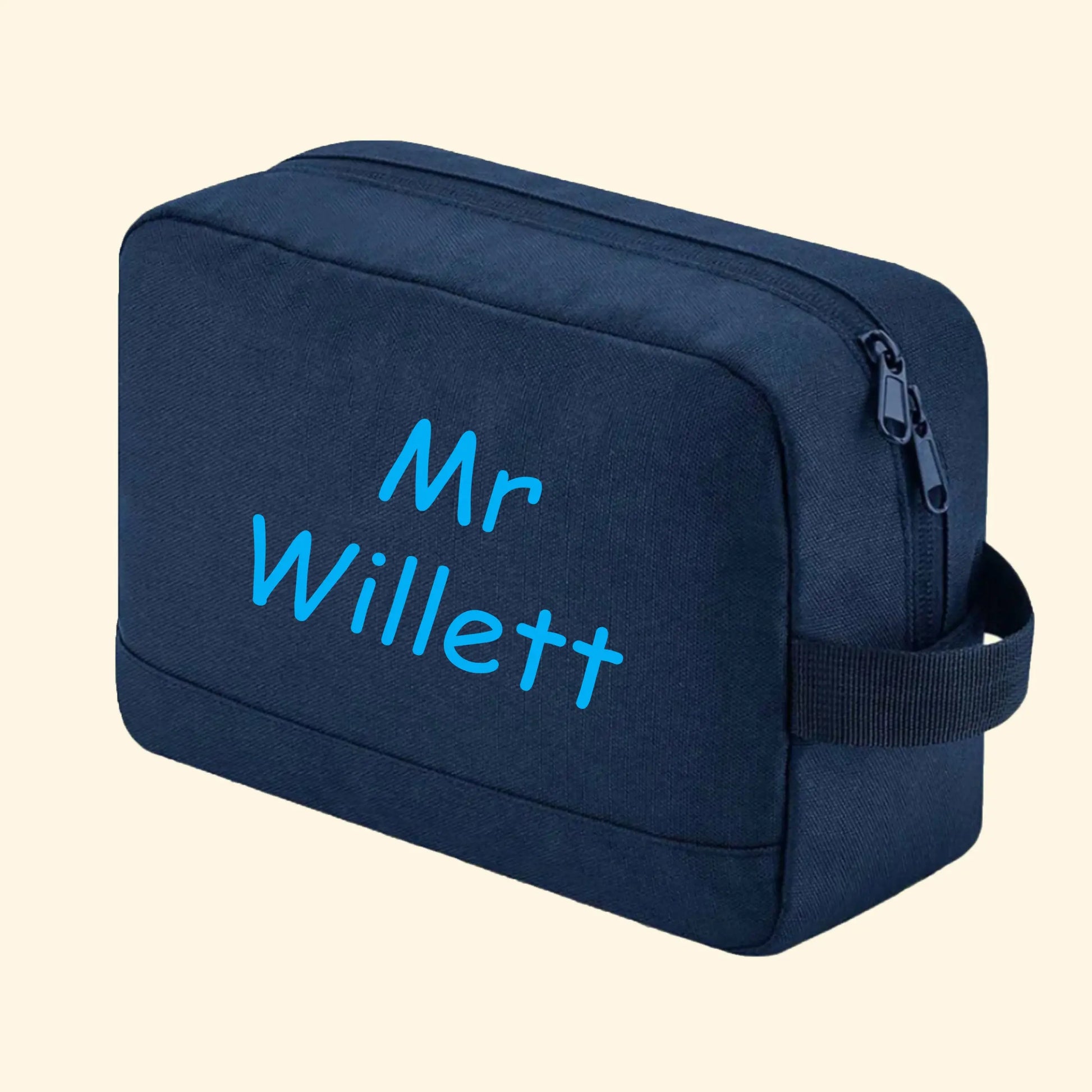 Navy wash bag with Mr Willett printed in comic sans in blue.
