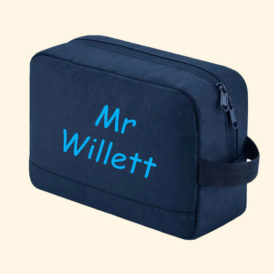 Navy wash bag with Mr Willett printed in comic sans in blue.