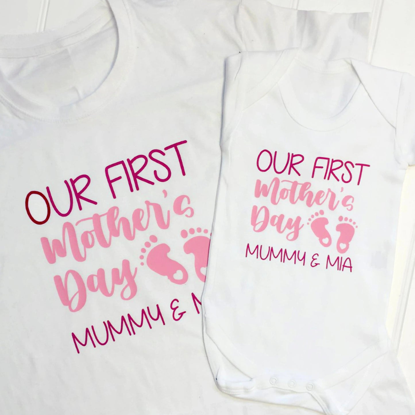 Our first mother's day set both items are white and read Mummy & Mia printed in two print colours fuchsia pink and light pink.