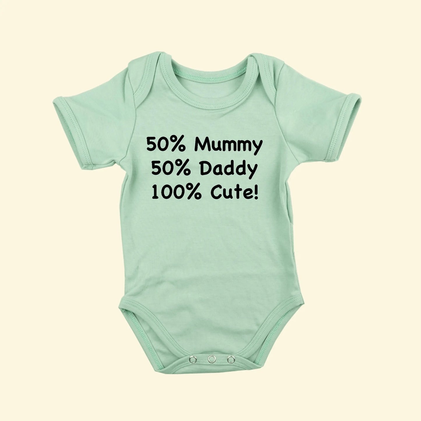 Light Green babygrow with 50% Mummy, 50% Daddy, 100% Cute! A great baby shower gift