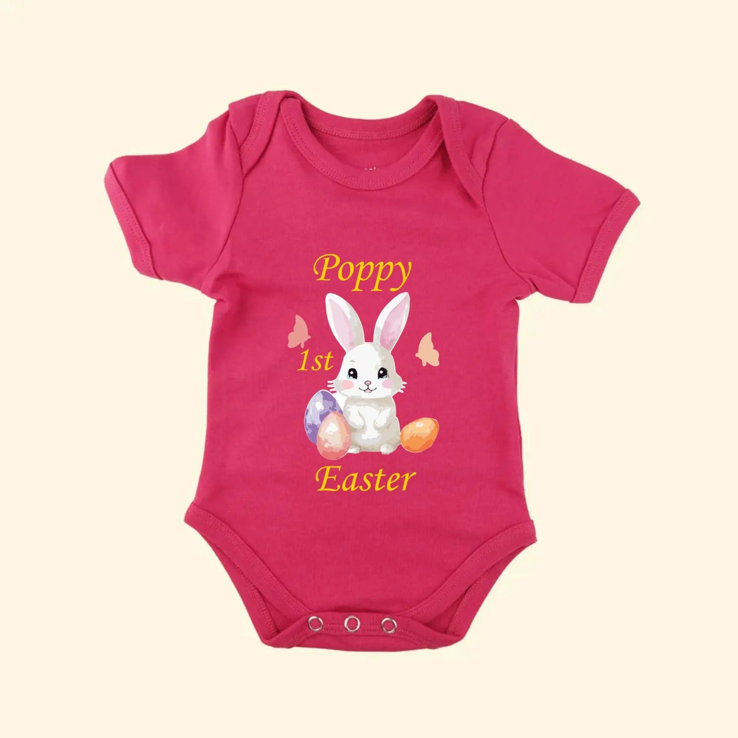 Pink babygrow with a Bunny and Easter Eggs with Poppy 1st Easter on the front