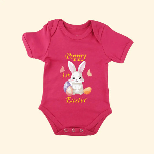 Pink babygrow with a Bunny and Easter Eggs with Poppy 1st Easter on the front