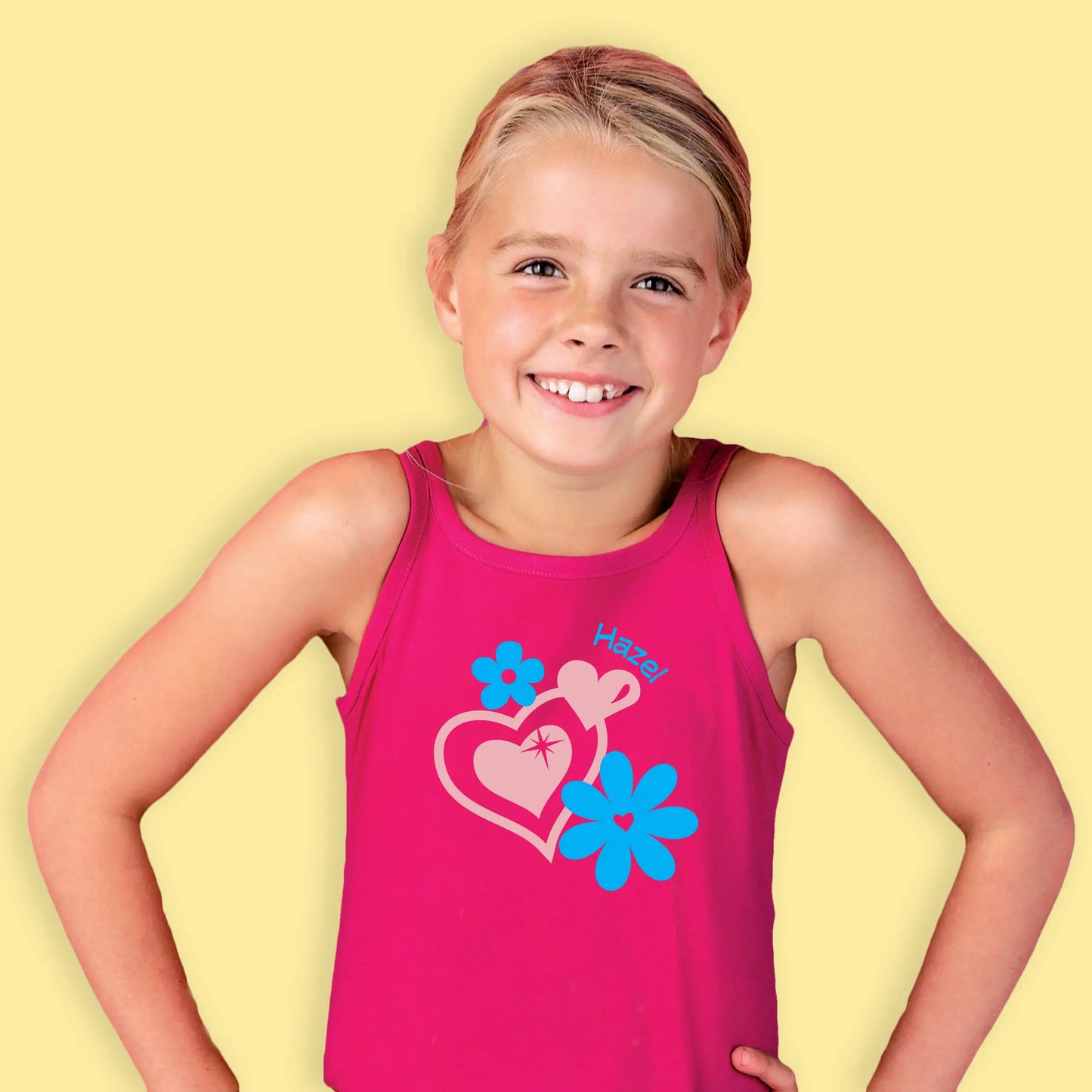 Pink dress printed with full colour design of hearts & flowers, printed in blue and light pink with the name in the top right of the design.