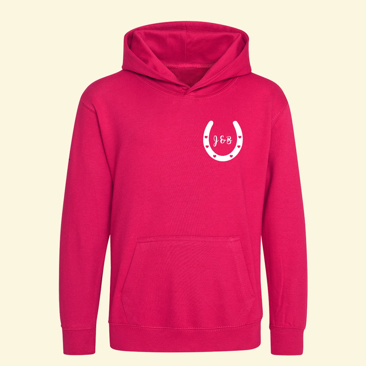 Front of a bright pink kids hoodie with an image of a horse shoe with initials from the names entered on the back.