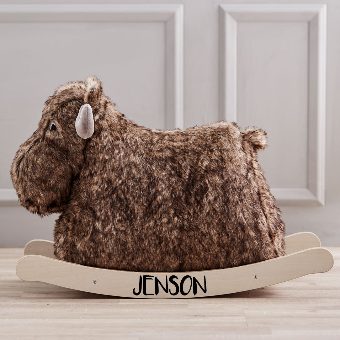 Brown rocking moose toy with grey antlers for handles, side view. The name Jenson is printed on the rockers