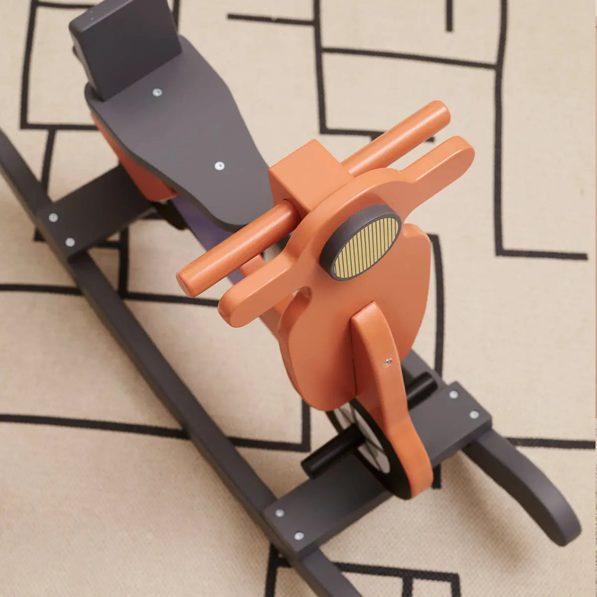 View from above of a rust coloured rocking scooter