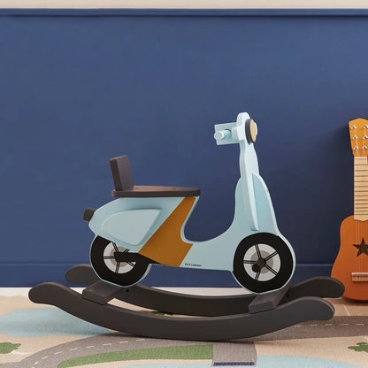Light blue rocking scooter with dark grey rockers. Set in a child's playroom next to a kids toy guitar, the room is painted in a royal blue colour.