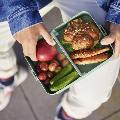 Nordic Sage lunch box, showing the inside with a divider, sandwiches and fruit.