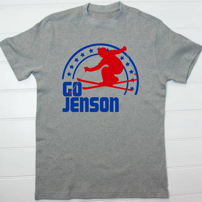 Grey t shirt with a red and royal blue ski design and he text Go Jenson