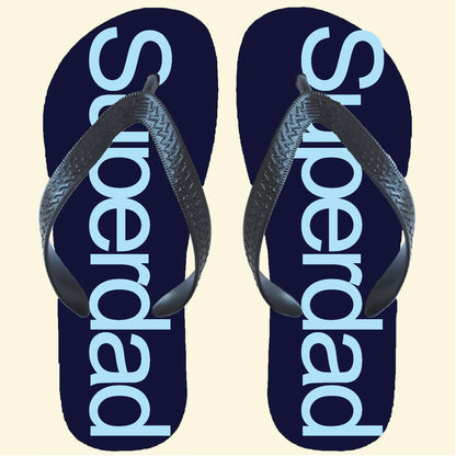 Navy flip flops with Superdad printed down the centre of each in light blue
