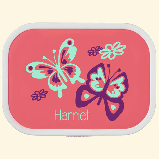 Pink campus lunch box with a butterfly design and the name Harriet