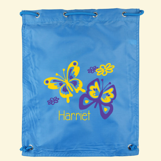 Aqua blue gym / swim bag with a pretty butterfly design in two colours with the name Harriet.