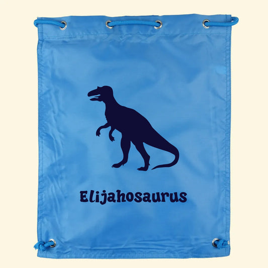 Aqua blue swim gym bag with a T rex dinosaur and a name printed on the front.