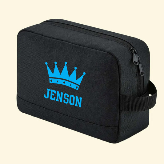 Black wash bag with a crown and the name Jenson printed in blue on one side