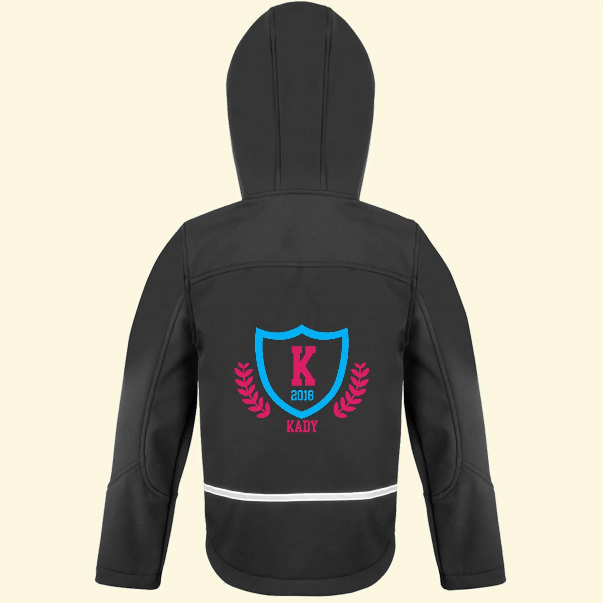Black softshell jacket with a college logo design on the back and the name Kady, initial K and the year 2018 printed in blue and pink colours