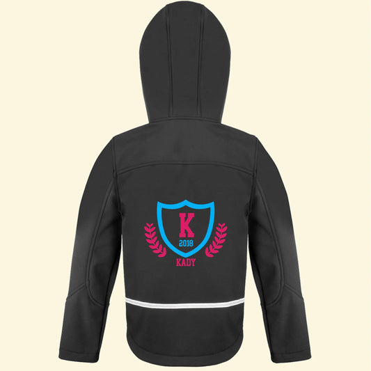 Black softshell jacket with a college logo design on the back and the name Kady, initial K and the year 2018 printed in blue and pink colours