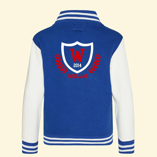 Blue varsity jacket with white sleeves. A college style logo design on the back with the name William, initials W and the year 2014