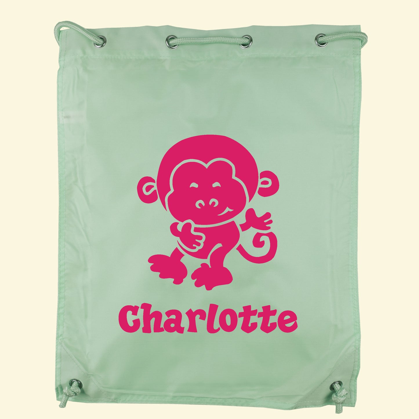 Light green gym swim bag with a monkey and the name Charlotte printed in pink on the front.