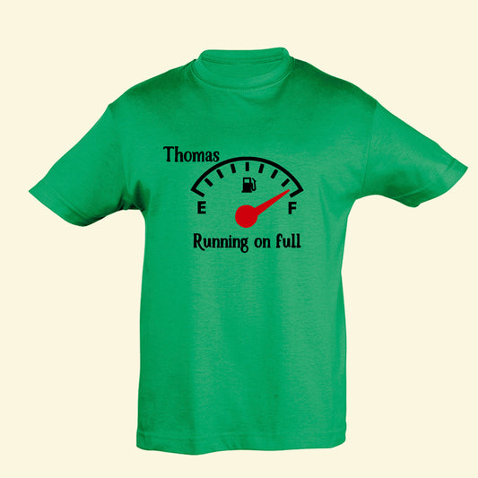 Green t shirt with a petrol style dial, with E for empty and F for full. The dial sits on F and the text underneath says Running on full. Above the dial to the left is the name Thomas