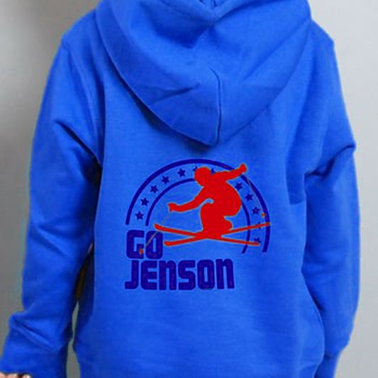 Child wearing a blue hoodie with a skier and Go Jenson printed on the back