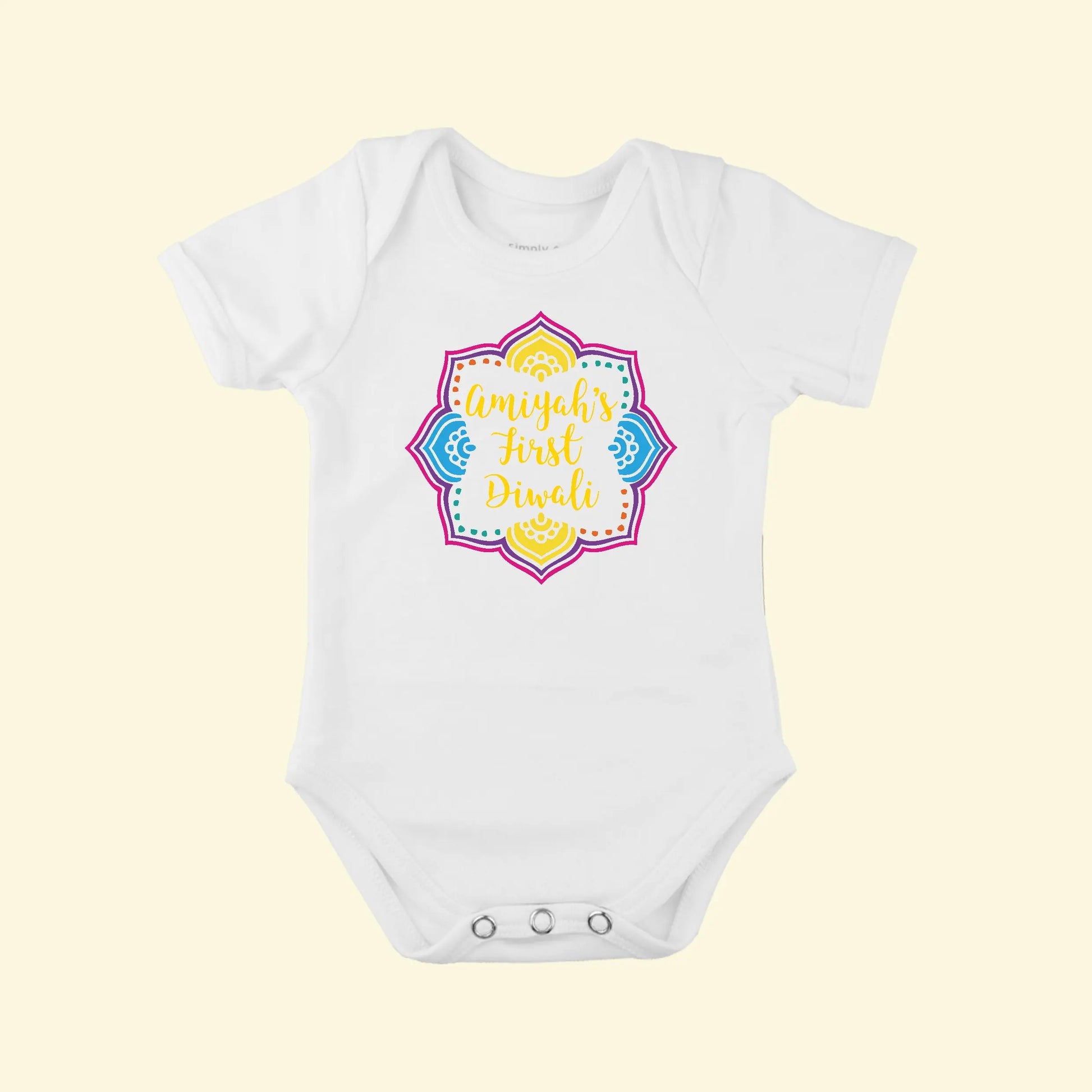 White babygrow with a colourful Diwali design with Amiyah's First Diwali printed in the centre.