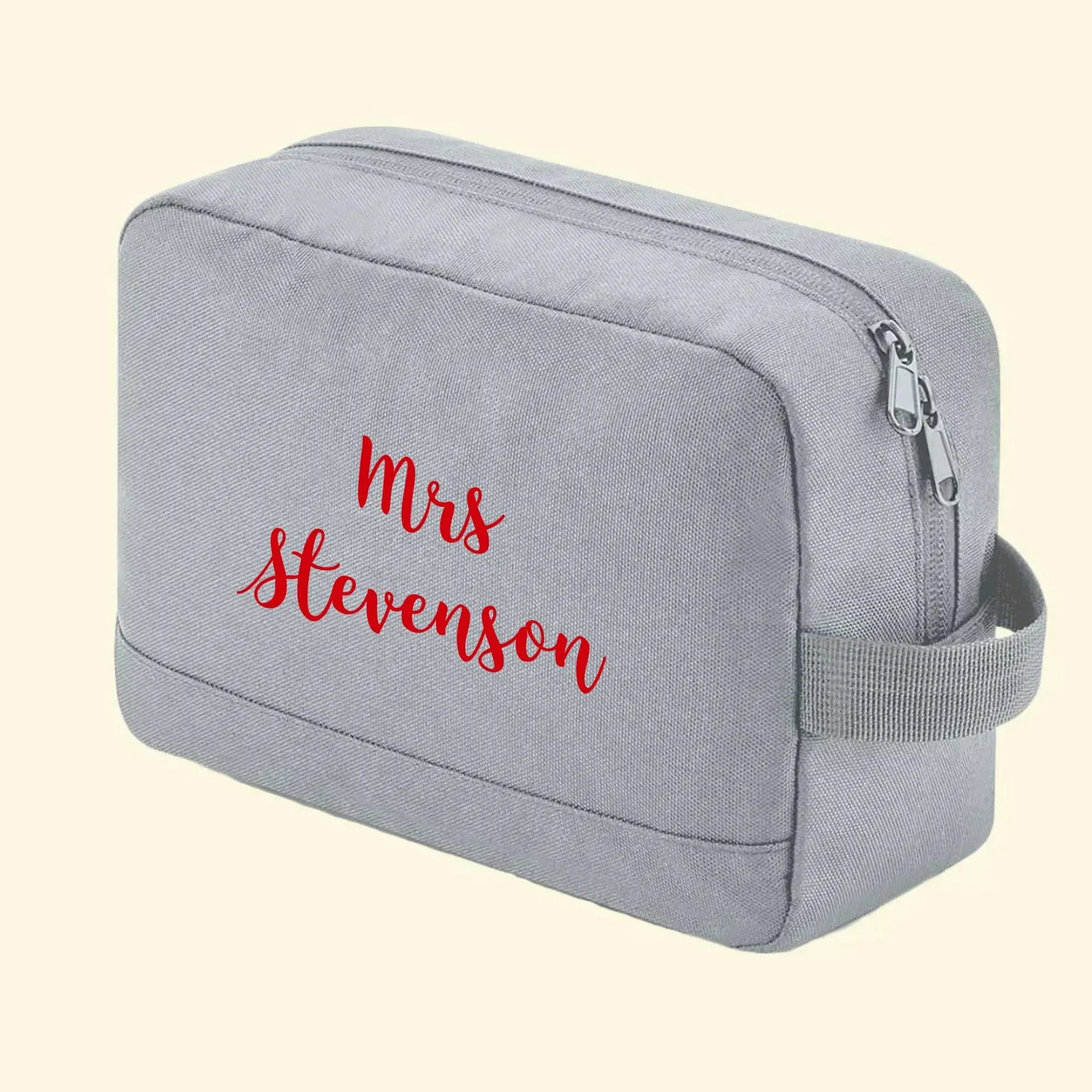 Grey wash bag with Mrs Stevenson printed on one side in king basil red