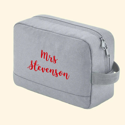 Grey wash bag with Mrs Stevenson printed on one side in king basil red