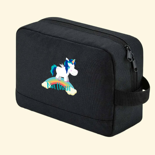 Black wash bag with a cute unicorn standing on a rainbow and the name Nathan printed underneath