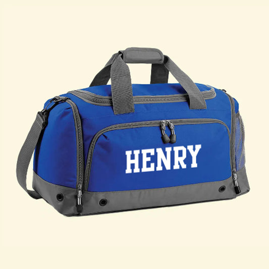 Royal blue sports bag with grey trim. On the front pocket is the name Henry in a sports style font