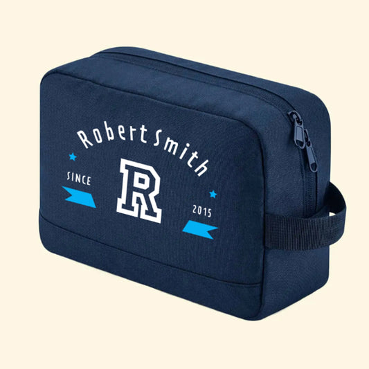 Navy wash bag with the name Robert Smith, the initial R and since 2015 printed on one side