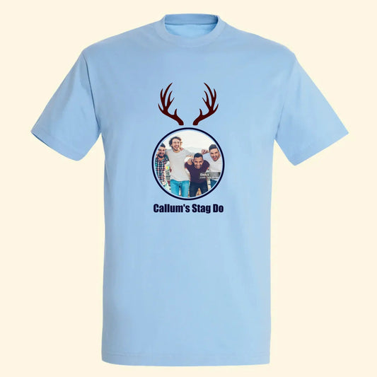 Light blue t shirt with your own photo in a circle with stag antlers above and Callum's stag do written underneath.