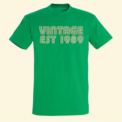 Green t shirt with vintage and est 1989 printed on the front in vibrant colours. Customise with your own year of birth
