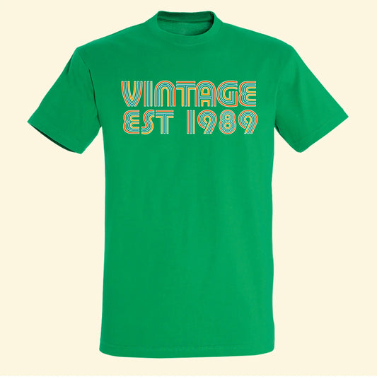 Green t shirt with vintage and est 1989 printed on the front in vibrant colours. Customise with your own year of birth