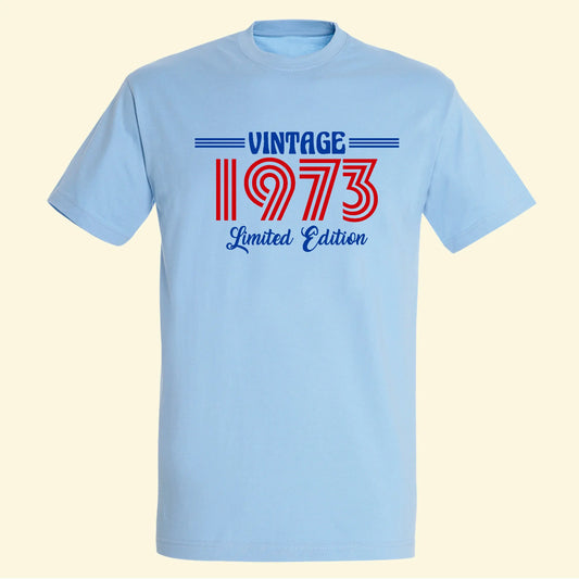 Light blue t shirt with a vintage design. The design says vintage, 1973 and limited edition on the front. Great for milestone birthdays.