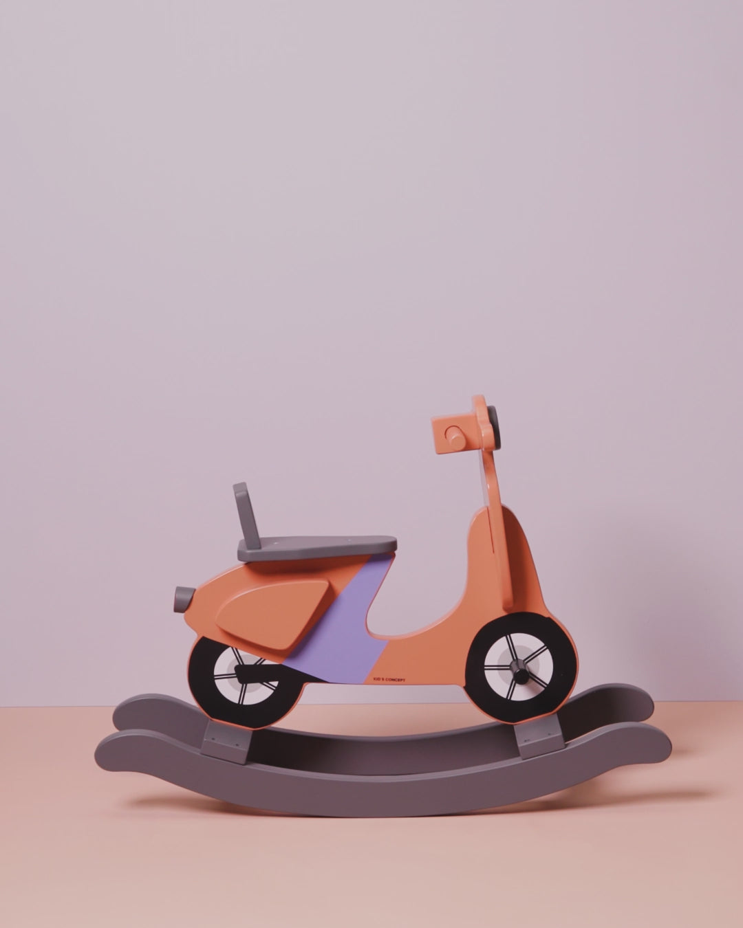 Short video of the rocking scooter, showing all sides and features, The scooter is rust and lilac colours.