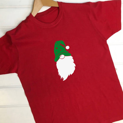 Red t shirt with a gonk design. The gonk has a green hat with stars on and a white bobble on the hat