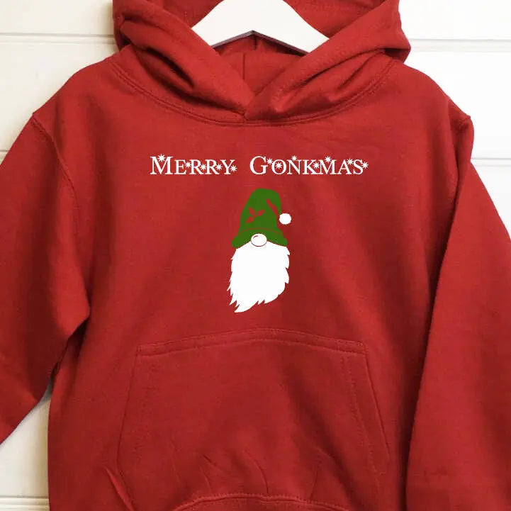 Red children's hoodie with a gonk wearing a green hat and the text Merry Gonkmas printed above the gonk on the front of the hoodie