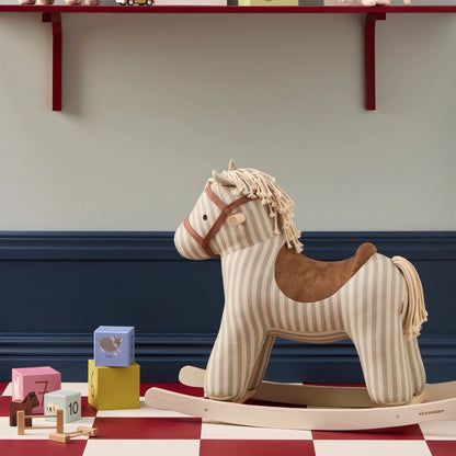 Rocking horse Sam toy with children's building blocks next to him